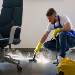 professional-cleaning-service-person-using-steam-cleaner-office